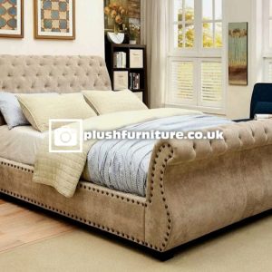Swan sleigh bed with a sophisticated design featuring a curved, elegant frame.