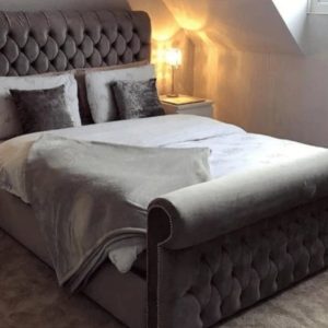 Sleigh bed collection featuring various luxurious designs with elegant curves and comfortable frames.