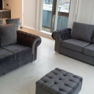 Contemporary sofa design with tufted cushions and a sleek, modern silhouette.
